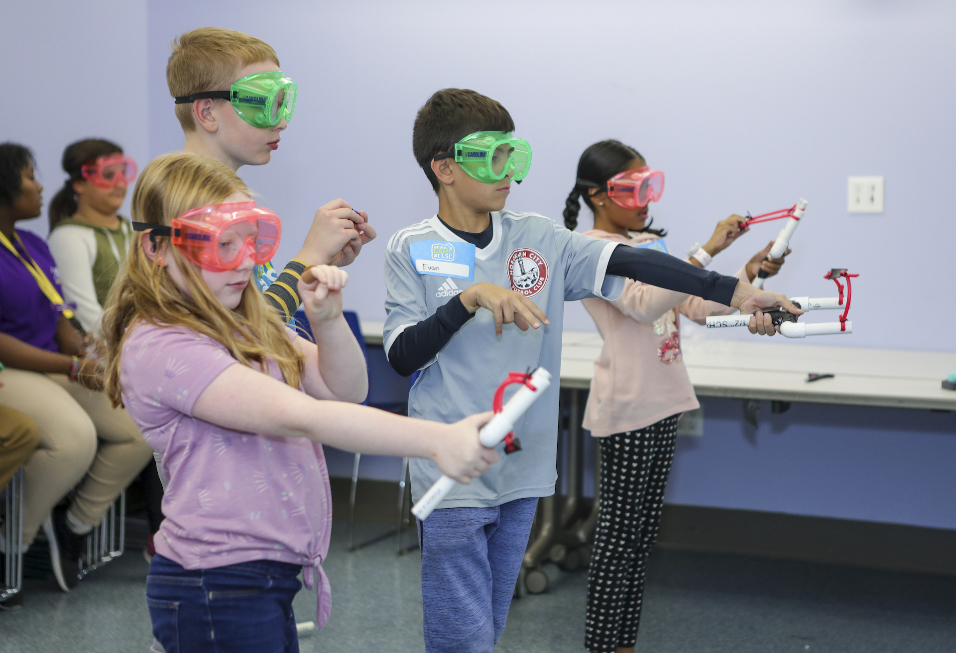 Kids testing slingshots