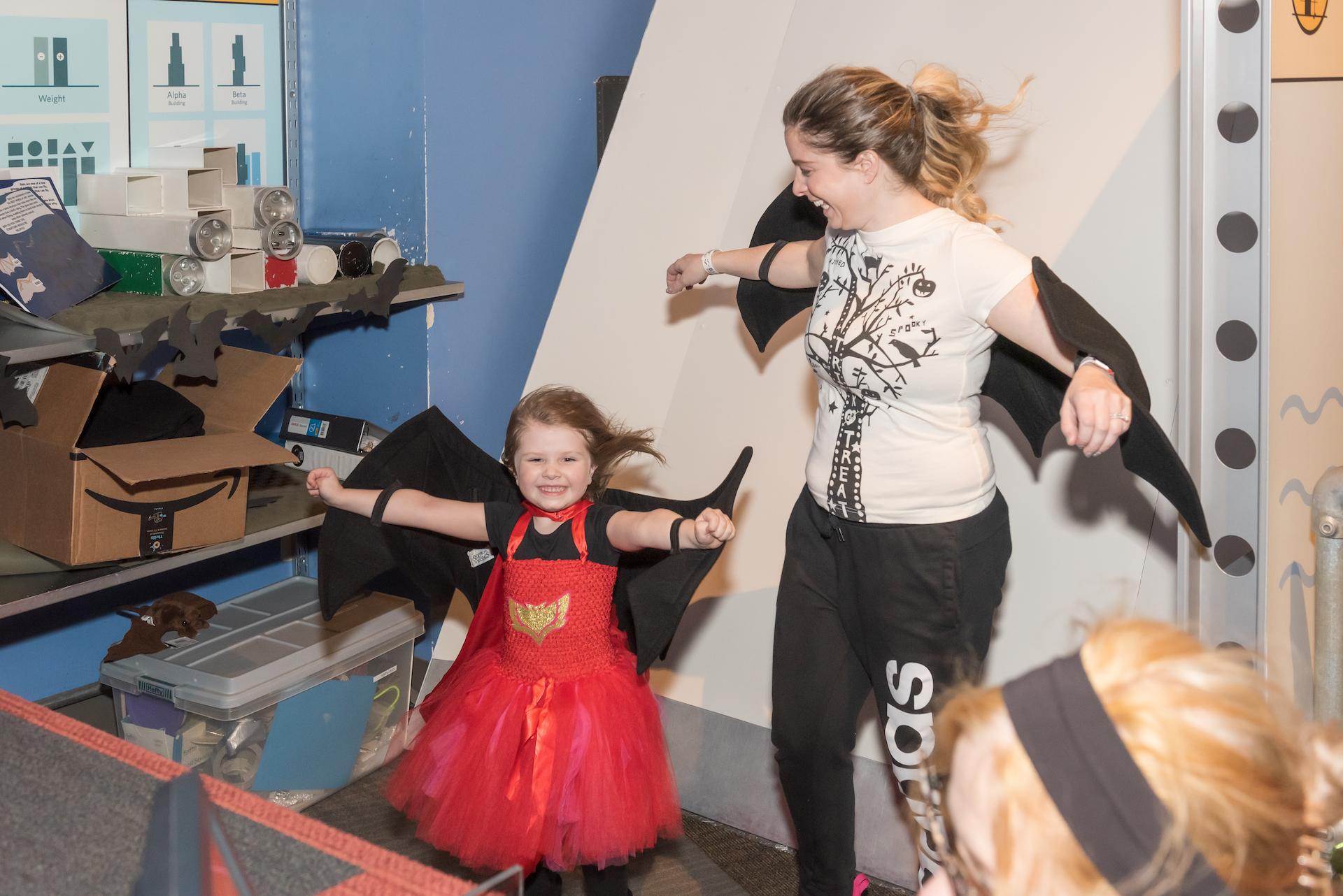 Guests trying on bat wings