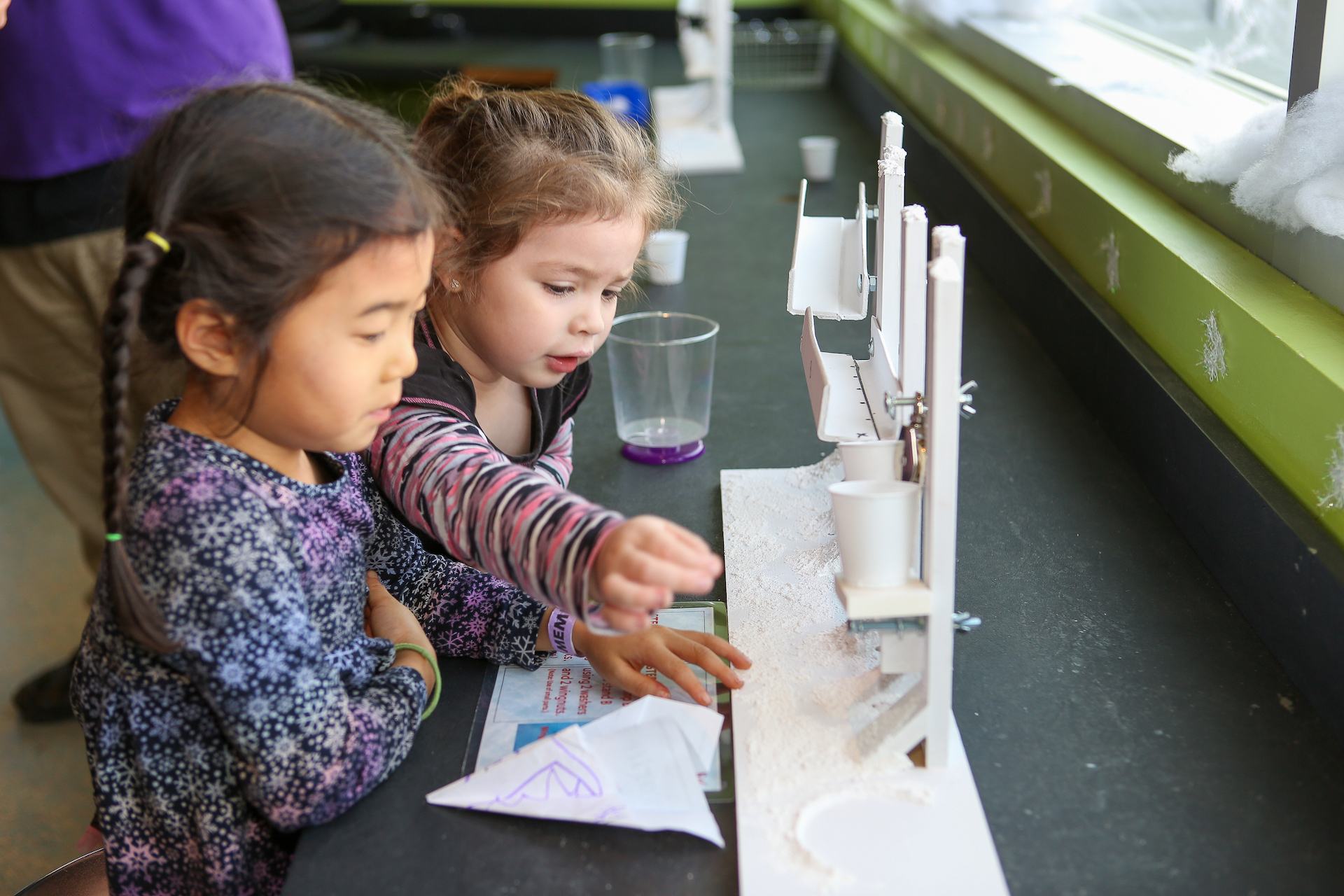 Kids making snow at the Snowflake Factory