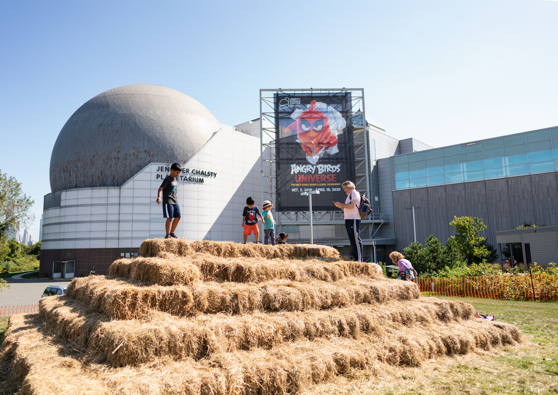 Kids climbing haystack