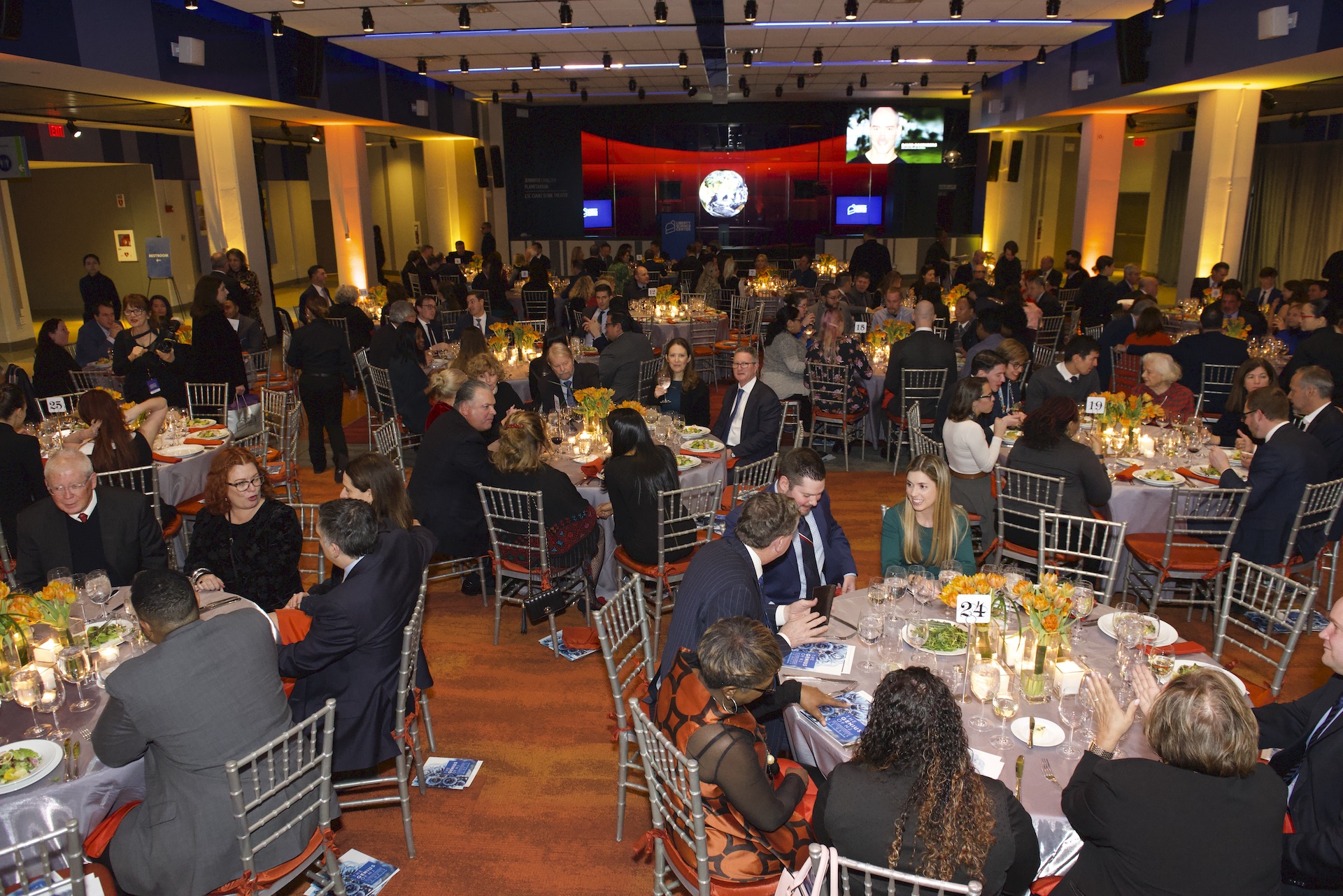 Guests enjoy dinner at Genius of NJ event