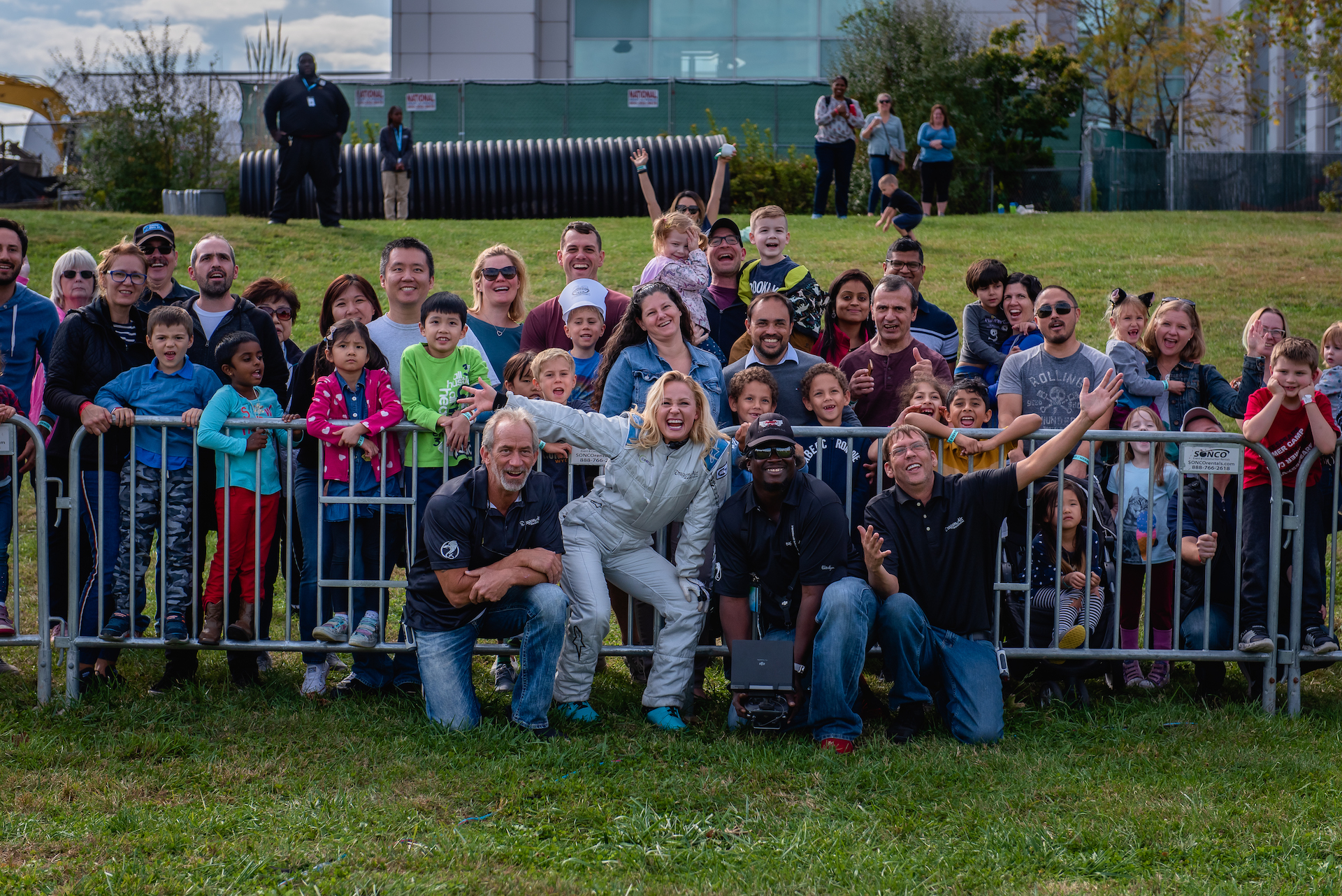 Mariah Cain and Team DragonAir take a group photo with guests