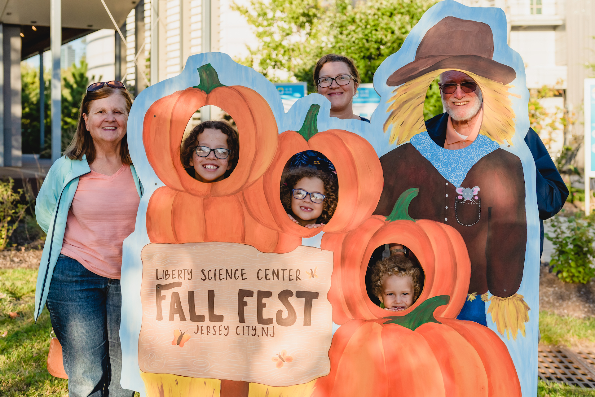 Family posing in Fall Fest photo op