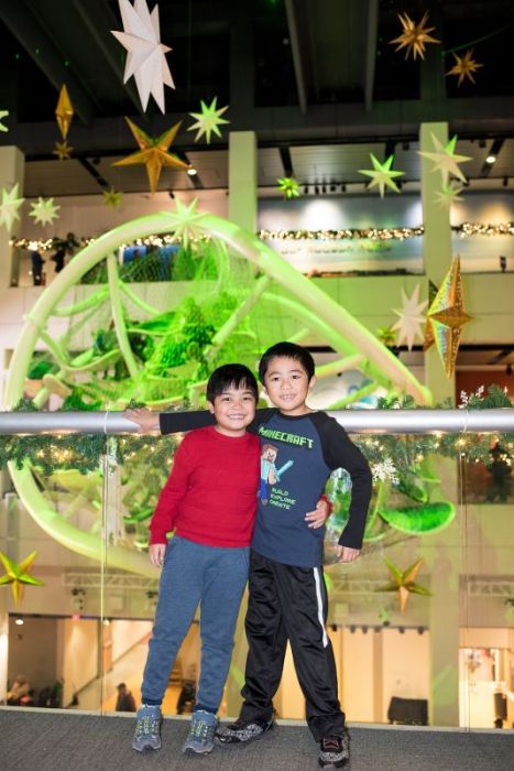 12 Days of Science photo contest winner (kids standing in front of Infinity Climber)