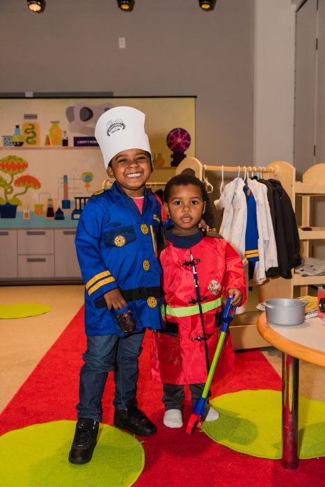 Two boys in outfits at Suit Up for Science activity