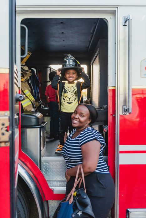 Family exploring firetruck 